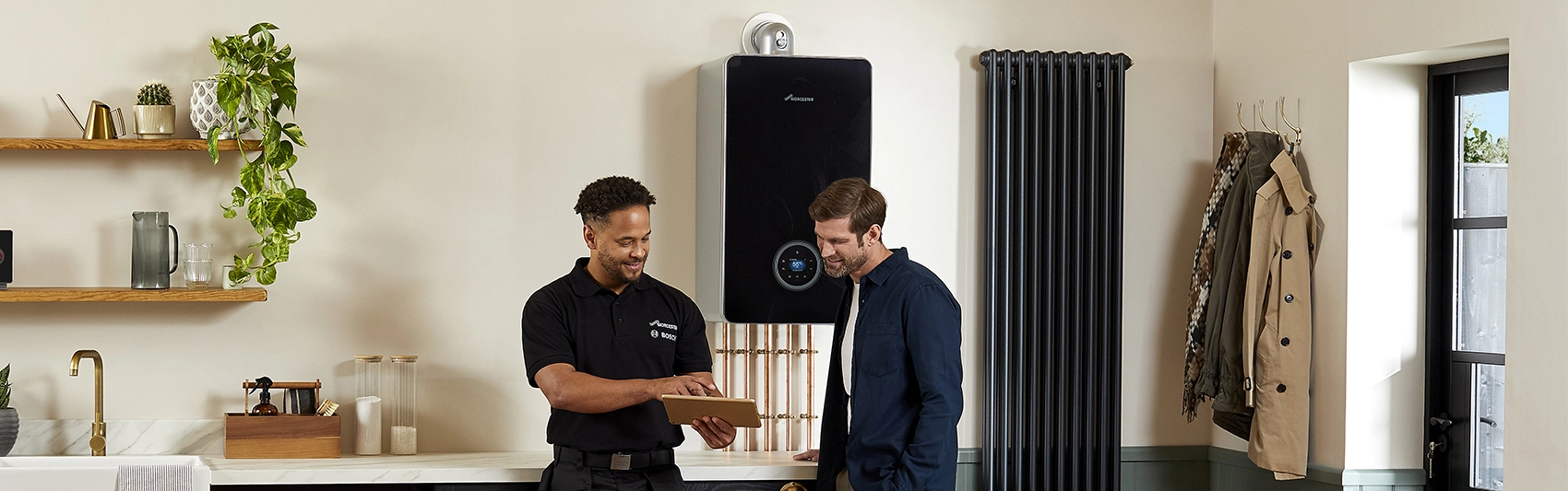 Installer and homeowner with boiler